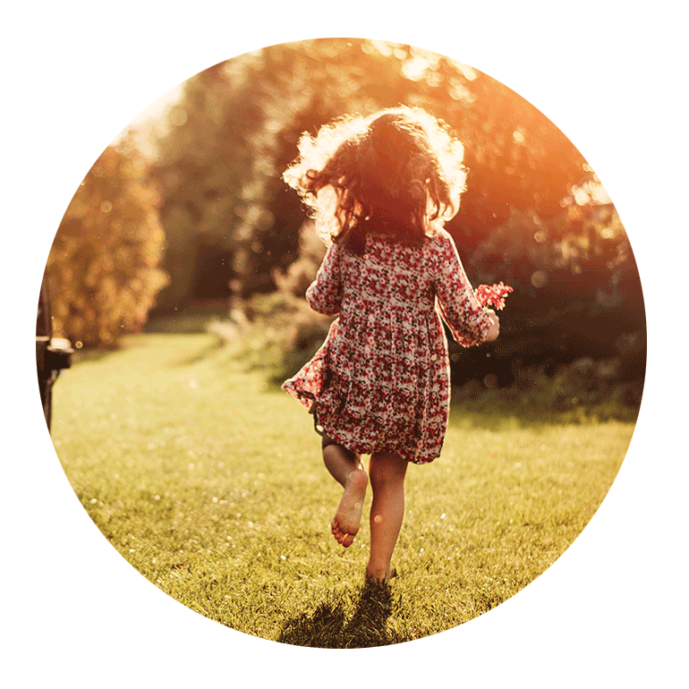 A little girl running in a field